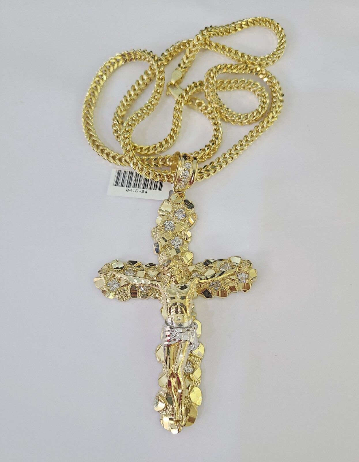 Detailed macro shot of 10K yellow gold Franco chain links