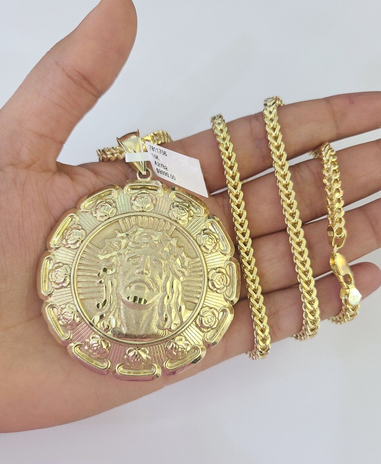Full display of 10K yellow gold Franco chain with Jesus and Virgin Mary pendant