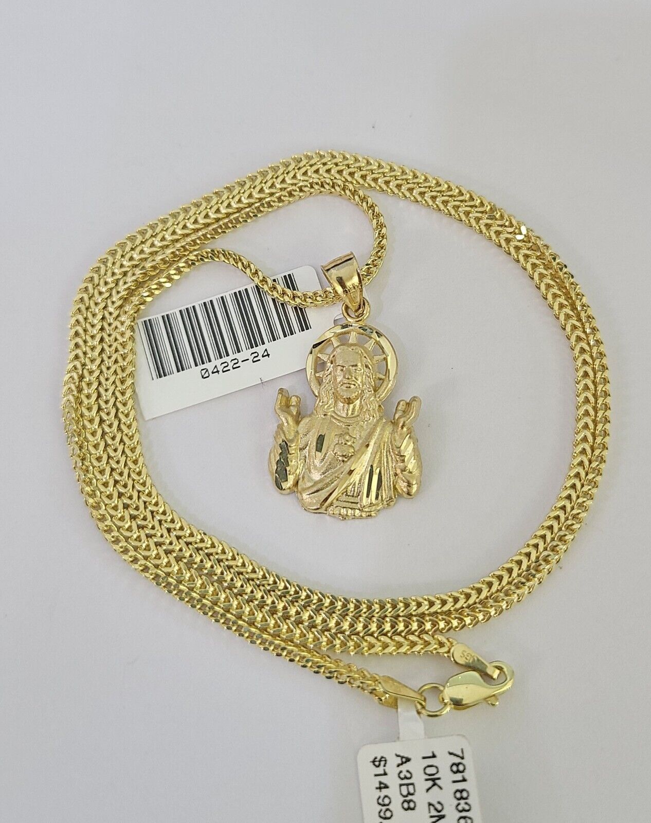 10K yellow gold Jesus pendant and Franco chain necklace set by Reva Jeweler