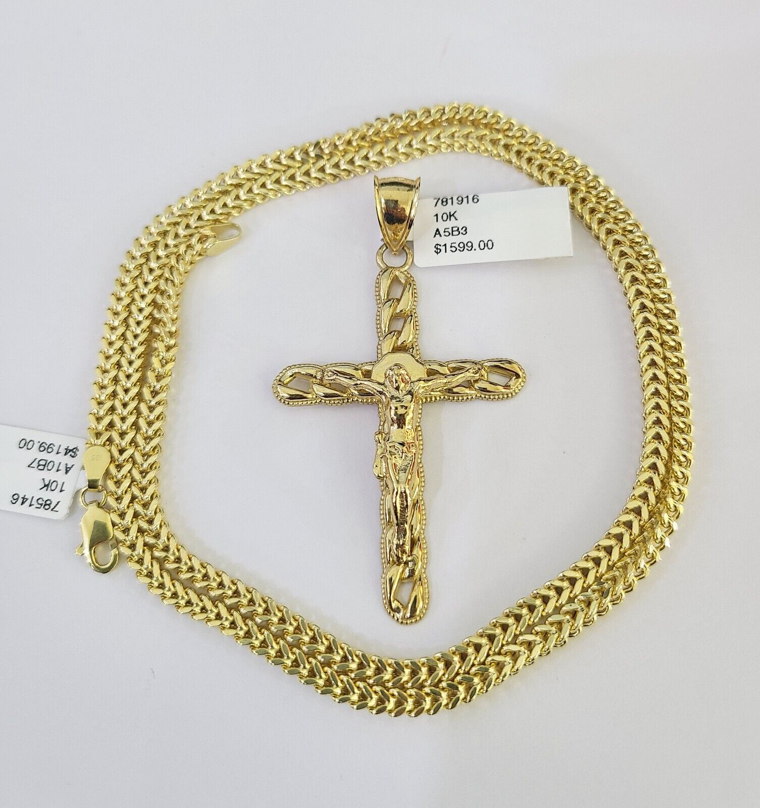 Side angle view of Franco chain necklace featuring Jesus cross pendant charm