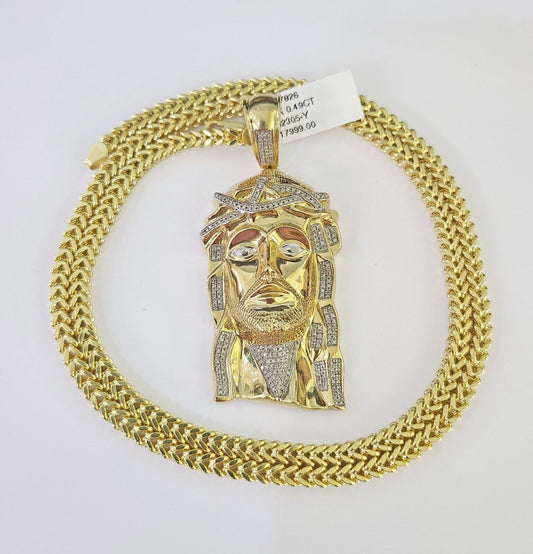 Close-up of 10K yellow gold diamond Jesus head pendant on Franco chain