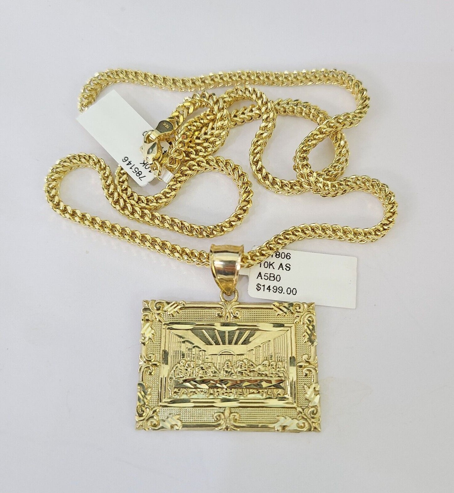 Full display of 10K yellow gold Franco chain with Last Supper pendant