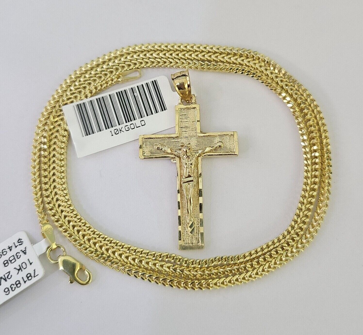 Side angle view of Franco chain necklace featuring Jesus cross pendant charm