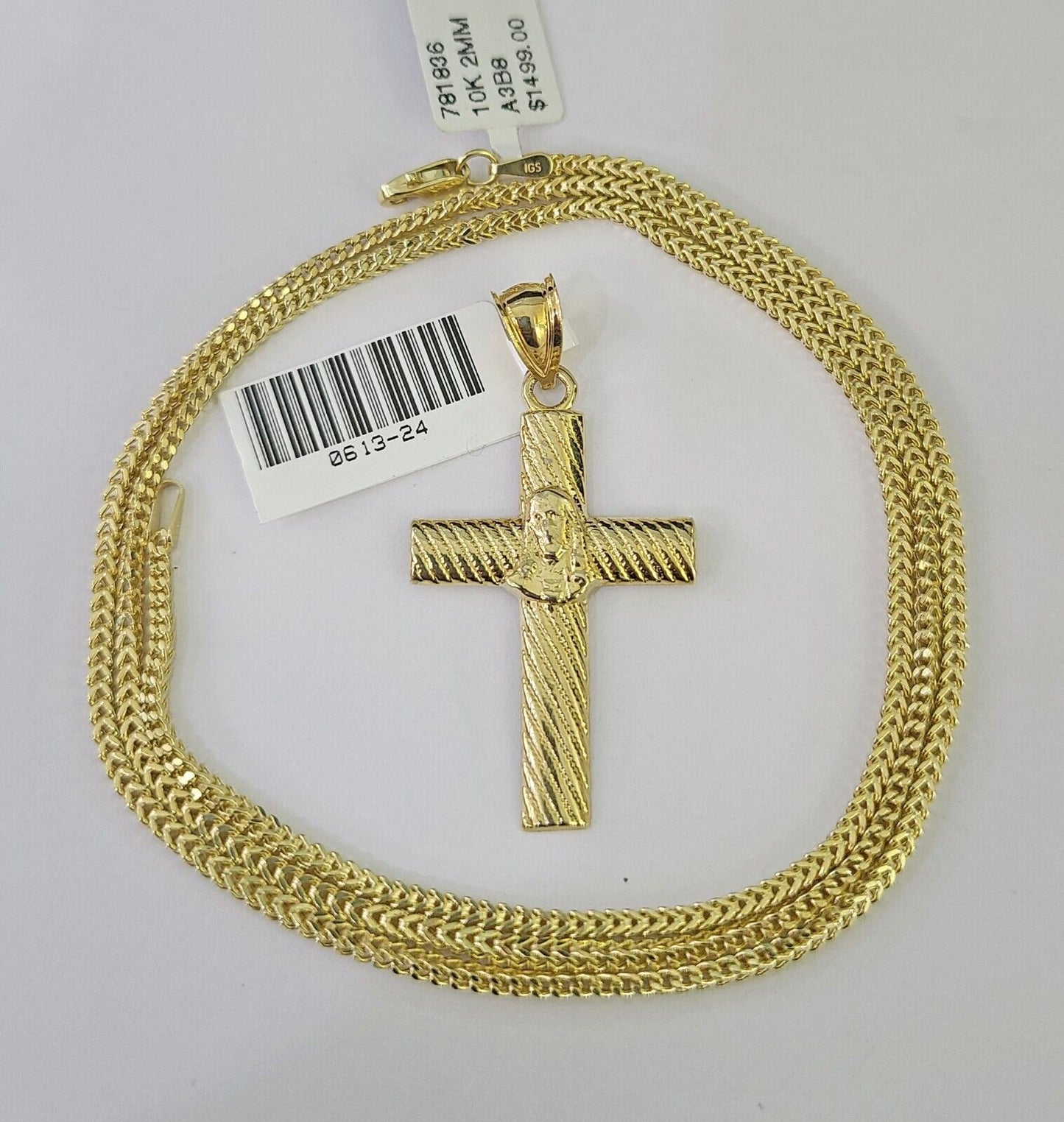 Front view of Jesus cross pendant necklace in 10K gold with Franco chain