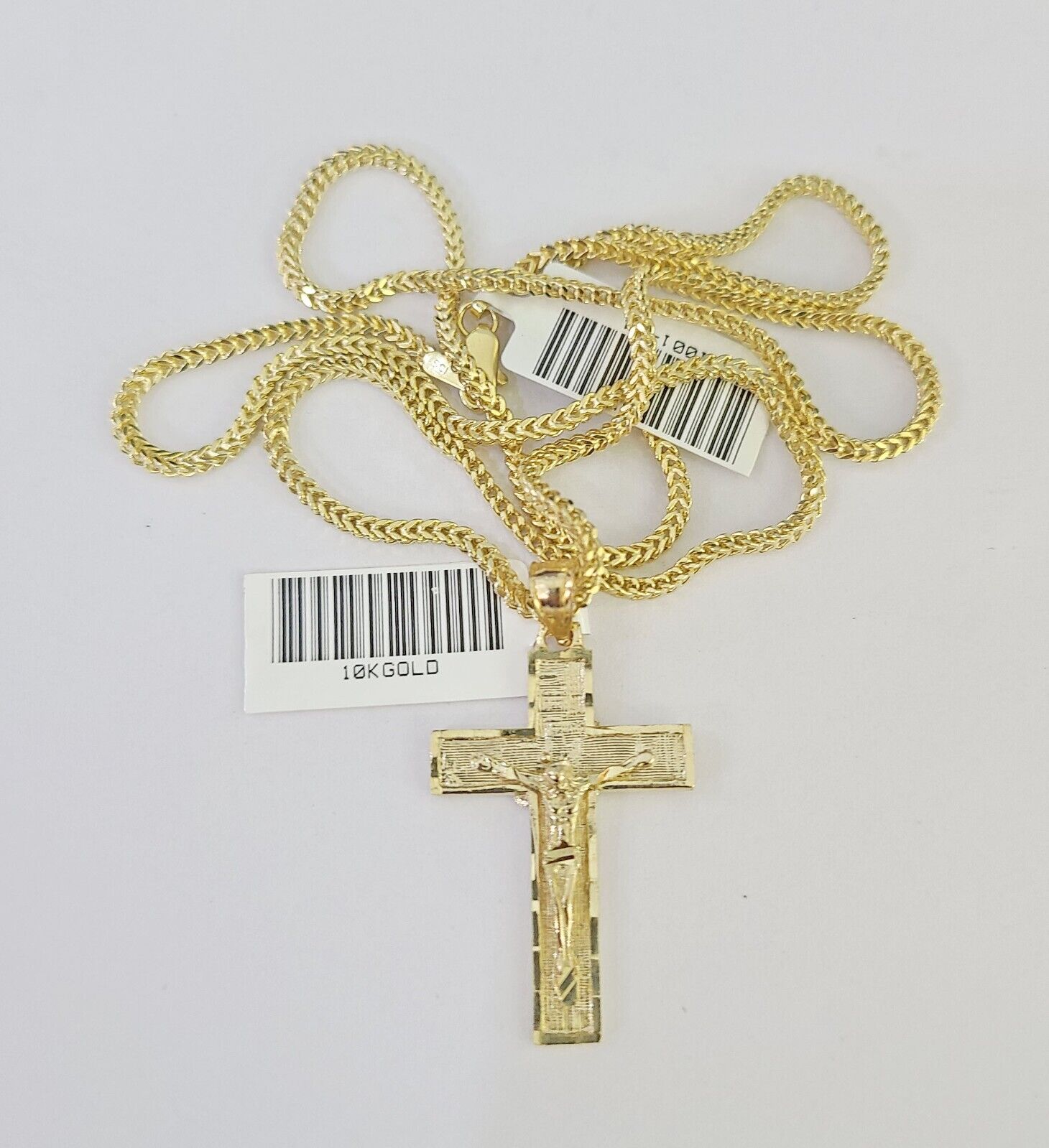 10K gold Franco chain necklace with Jesus cross pendant charm by Reva Jeweler