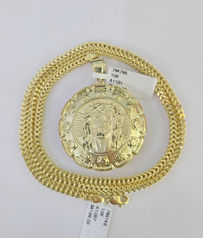 Flat lay display of Reva Jeweler 10K yellow gold Jesus and Mary necklace set