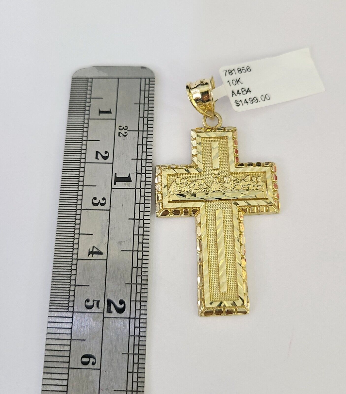 Front-facing view of Reva Jeweler 10K gold Last Supper cross pendant and chain
